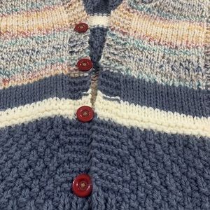 Homemade knitting sweater with hood.